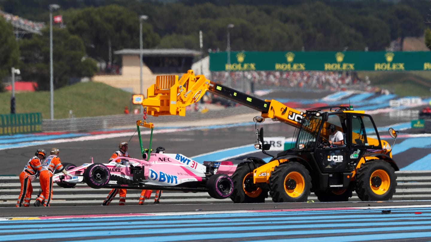 The car of Esteban Ocon (FRA) Force India VJM11 is recovered after crashing on lap one at Formula One World Championship, Rd8, French Grand Prix, Race, Paul Ricard, France, Sunday 24 June 2018. © Steven Tee/LAT/Sutton Images