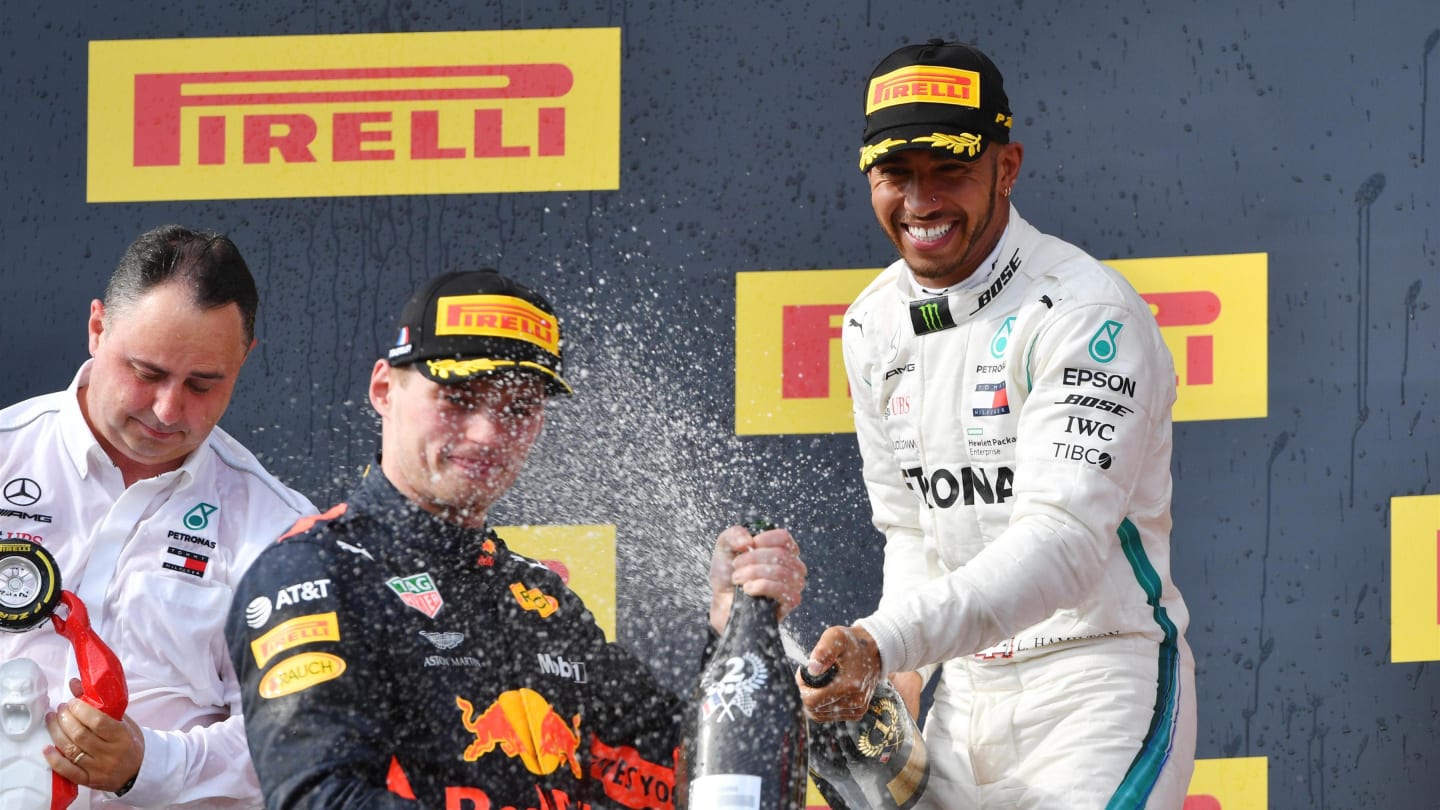 Max Verstappen (NED) Red Bull Racing and Lewis Hamilton (GBR) Mercedes-AMG F1 celebrate on the podium with the champagne at Formula One World Championship, Rd8, French Grand Prix, Race, Paul Ricard, France, Sunday 24 June 2018. © Mark Sutton/Sutton Images