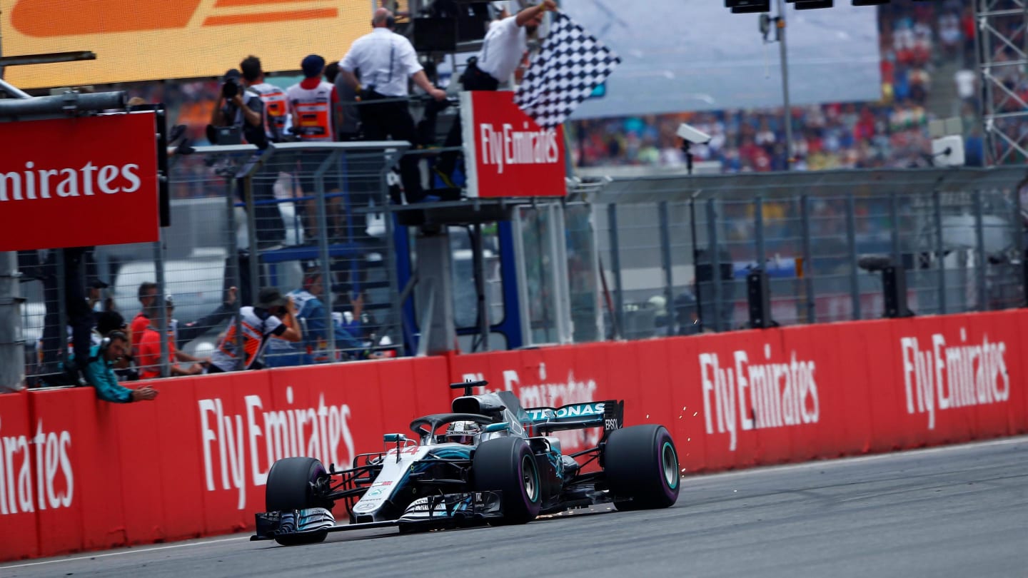 Race winner Lewis Hamilton (GBR) Mercedes-AMG F1 W09 EQ Power+ takes the chequered flag at Formula One World Championship, Rd11, German Grand Prix, Race, Hockenheim, Germany, Sunday 22 July 2018. © Andy Hone/LAT/Sutton Images