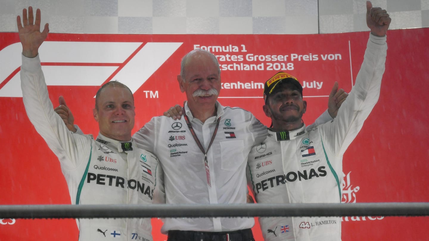 (L to R): Valtteri Bottas (FIN) Mercedes-AMG F1, Dr. Dieter Zetsche (GER), CEO of Daimler AG and Lewis Hamilton (GBR) Mercedes-AMG F1 celebrate on the podium at Formula One World Championship, Rd11, German Grand Prix, Race, Hockenheim, Germany, Sunday 22 July 2018. © Mark Sutton/Sutton Images