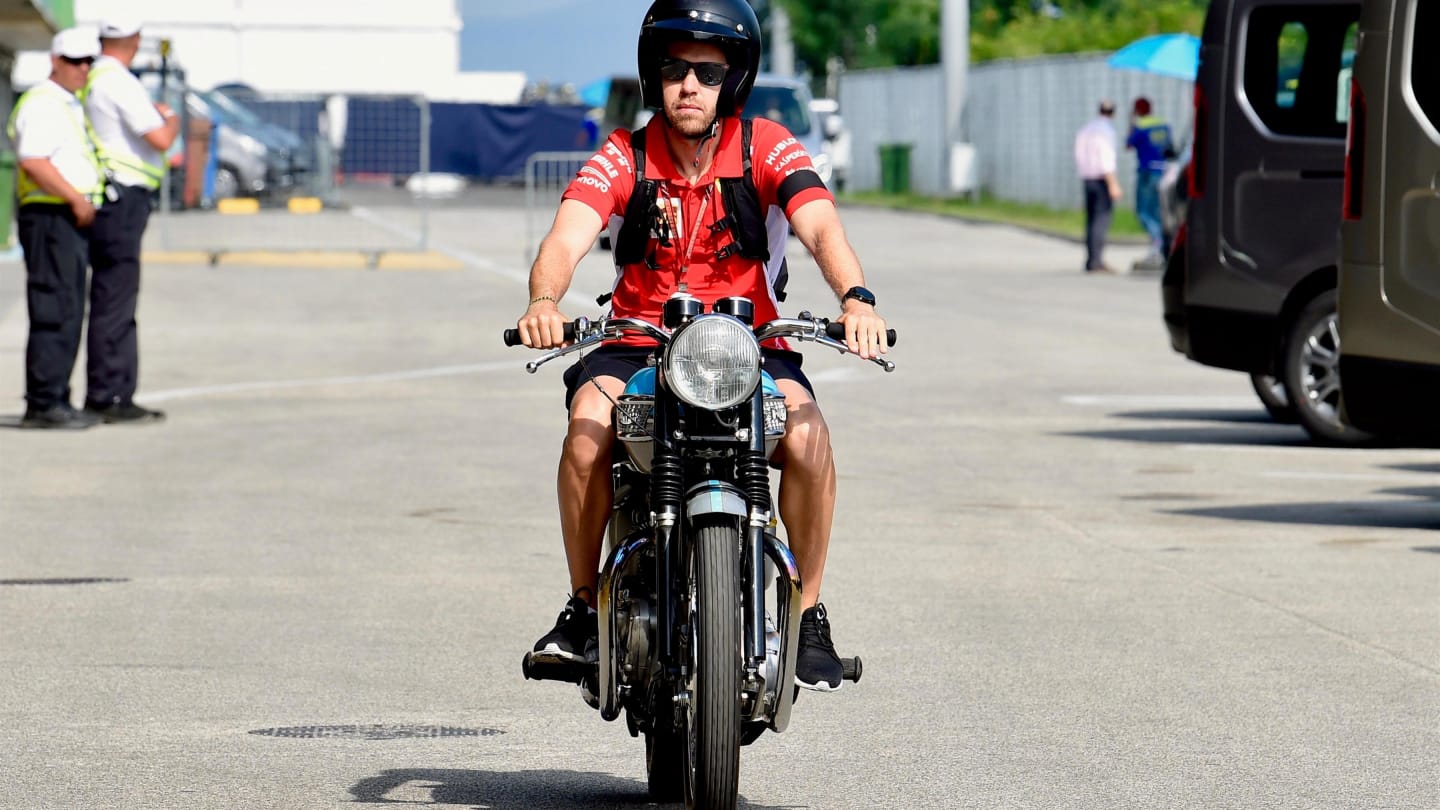 Sebastian Vettel (GER) Ferrari on his Triumph motorbike at Formula One World Championship, Rd12,