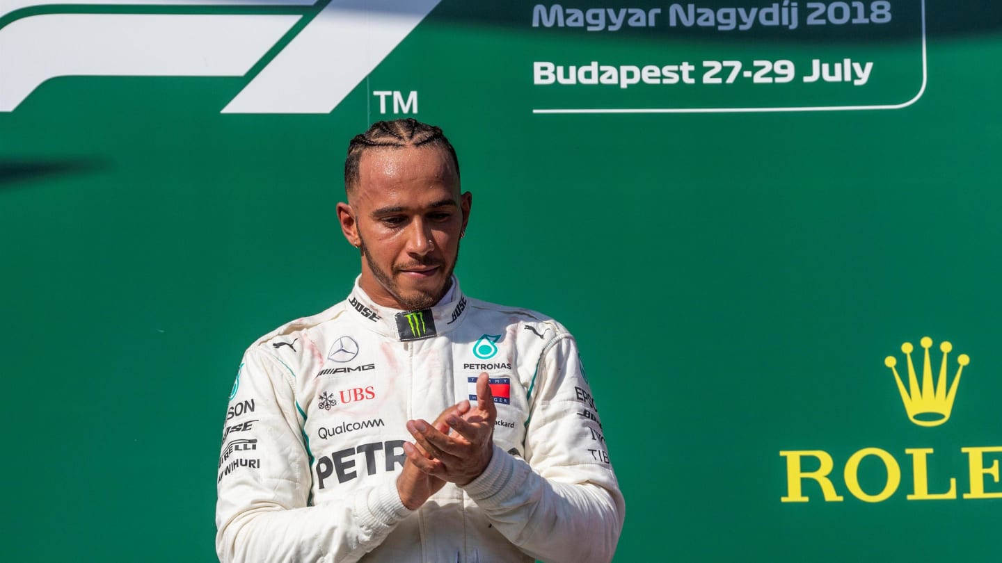 Lewis Hamilton (GBR) Mercedes-AMG F1 on the podium at Formula One World Championship, Rd12,