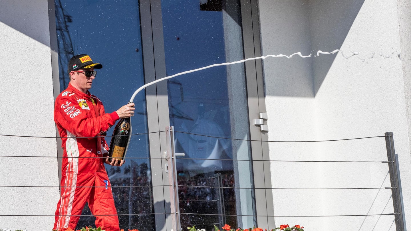 Kimi Raikkonen (FIN) Ferrari celebrates on the podium with the champagne at Formula One World Championship, Rd12, Hungarian Grand Prix, Race, Hungaroring, Hungary, Sunday 29 July 2018. © Manuel Goria/Sutton Images
