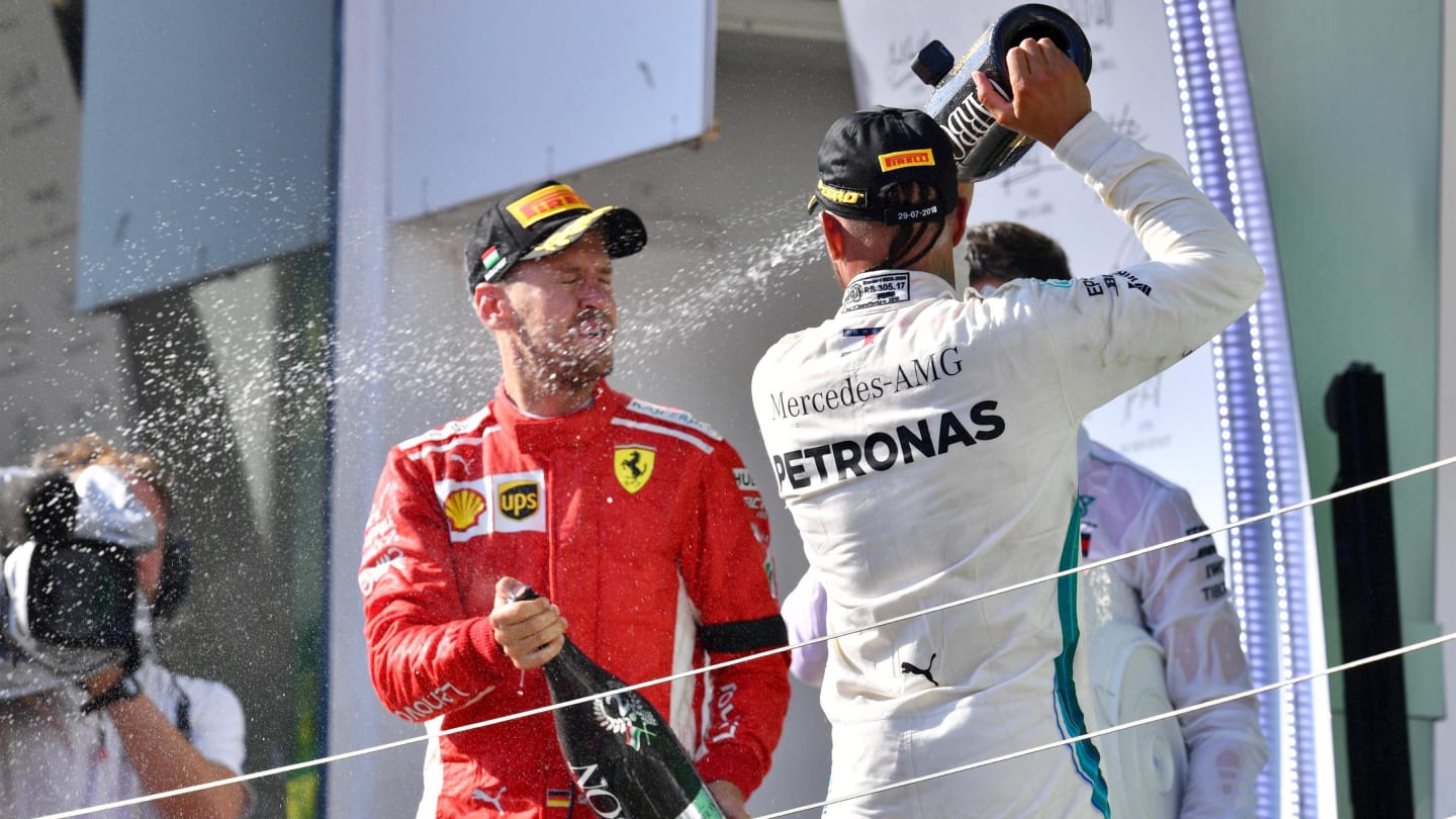 Lewis Hamilton (GBR) Mercedes-AMG F1 and Sebastian Vettel (GER) Ferrari celebrates on the podium