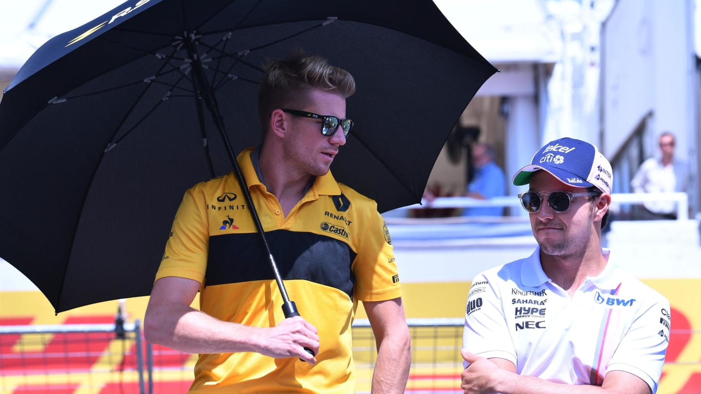 Sergio Perez (MEX) Force India and Nico Hulkenberg (GER) Renault Sport F1 Team on the drivers