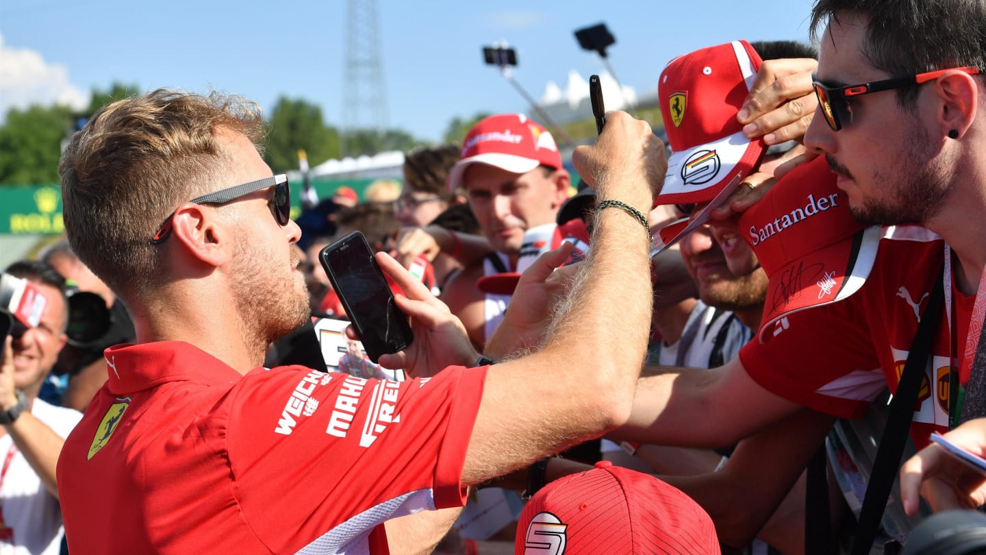 Sebastian Vettel (GER) Ferrari signs autographs for the fans at Formula One World Championship, Rd12, Hungarian Grand Prix, Preparations, Hungaroring, Hungary, Thursday 26 July 2018. © Jerry Andre/Sutton Images