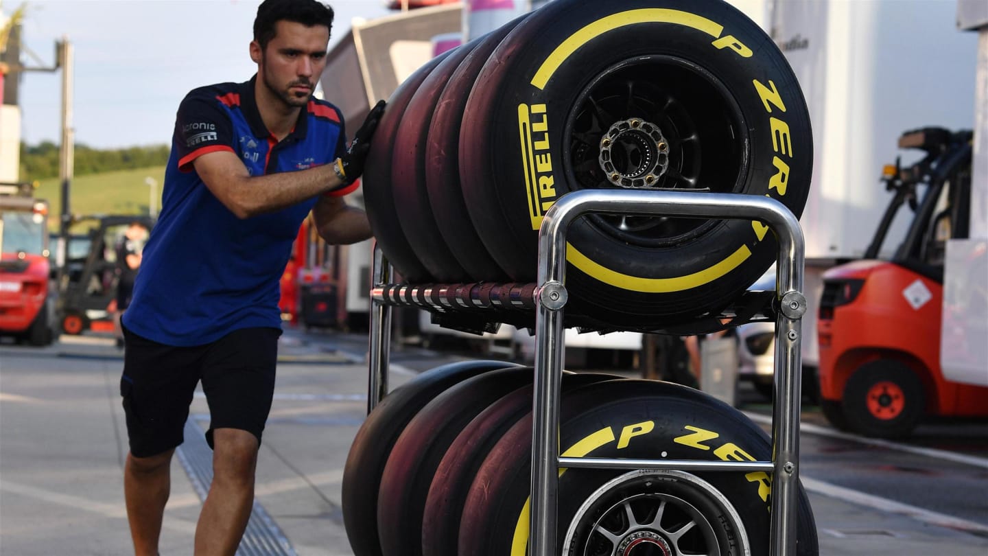 Scuderia Toro Rosso mechanic and Pirelli tyres at Formula One Testing, Day One, Hungaroring,