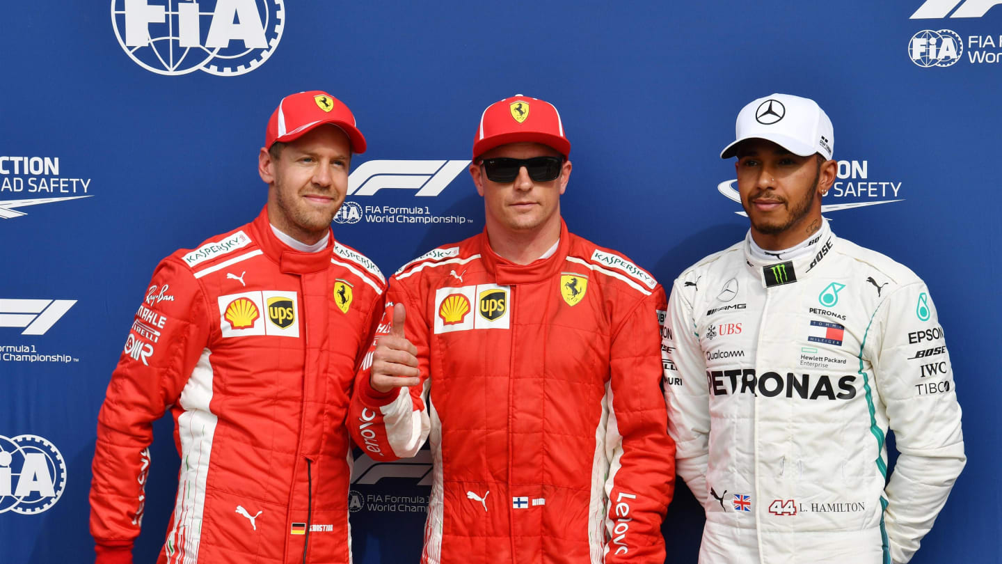 (L to R): Sebastian Vettel, Ferrari, pole sitter Kimi Raikkonen, Ferrari and Lewis Hamilton,