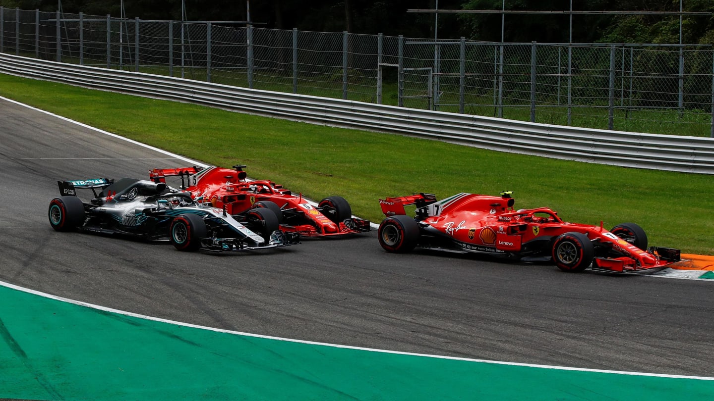 Kimi Raikkonen, Ferrari SF71H leads and Sebastian Vettel, Ferrari SF71H and Lewis Hamilton,