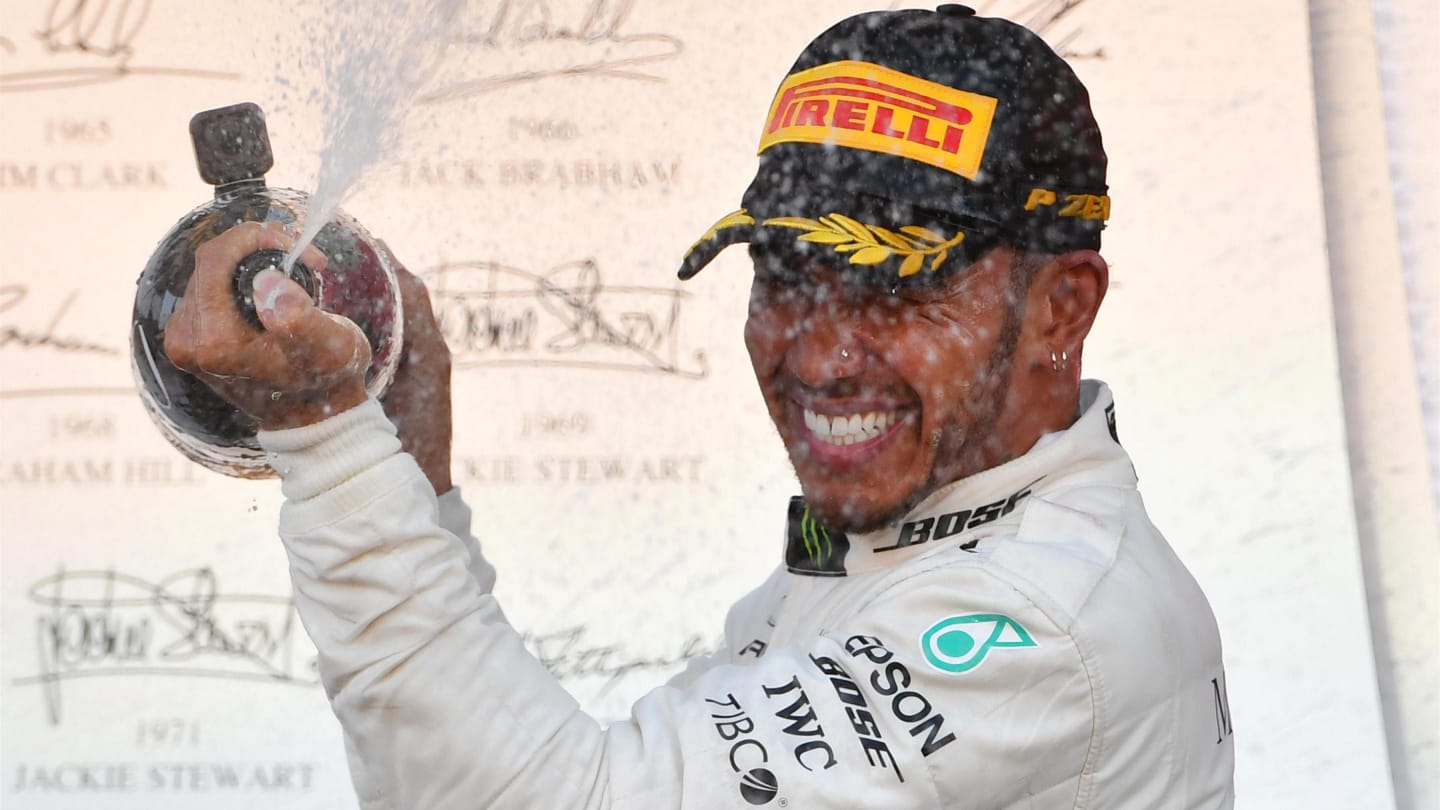 Race winner Lewis Hamilton, Mercedes AMG F1 celebrates on the podium with the champagne at Formula One World Championship, Rd17, Japanese Grand Prix, Race, Suzuka, Japan, Sunday 7 October 2018.