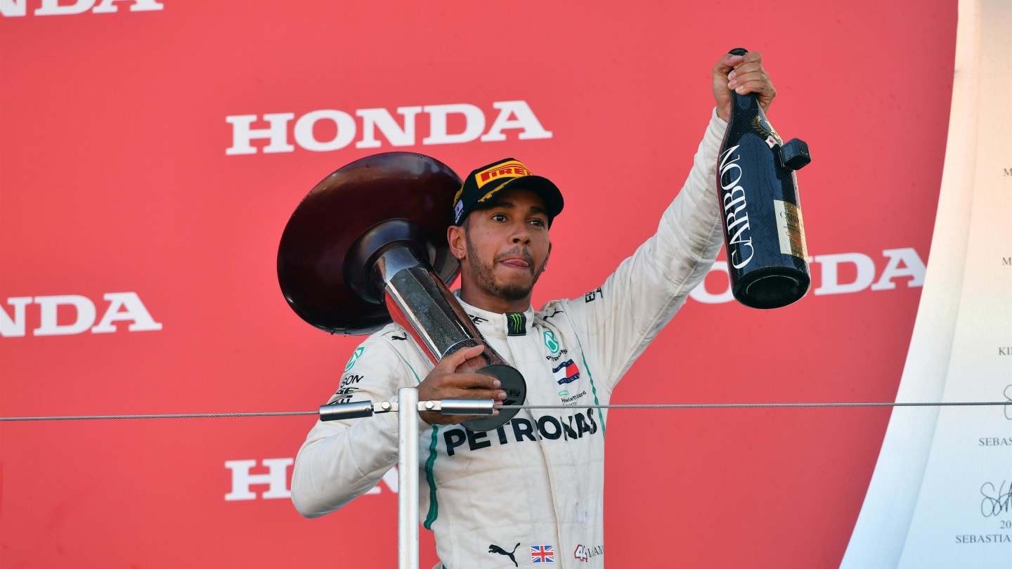 Race winner Lewis Hamilton, Mercedes AMG F1 celebrates on the podium with the trophy and the