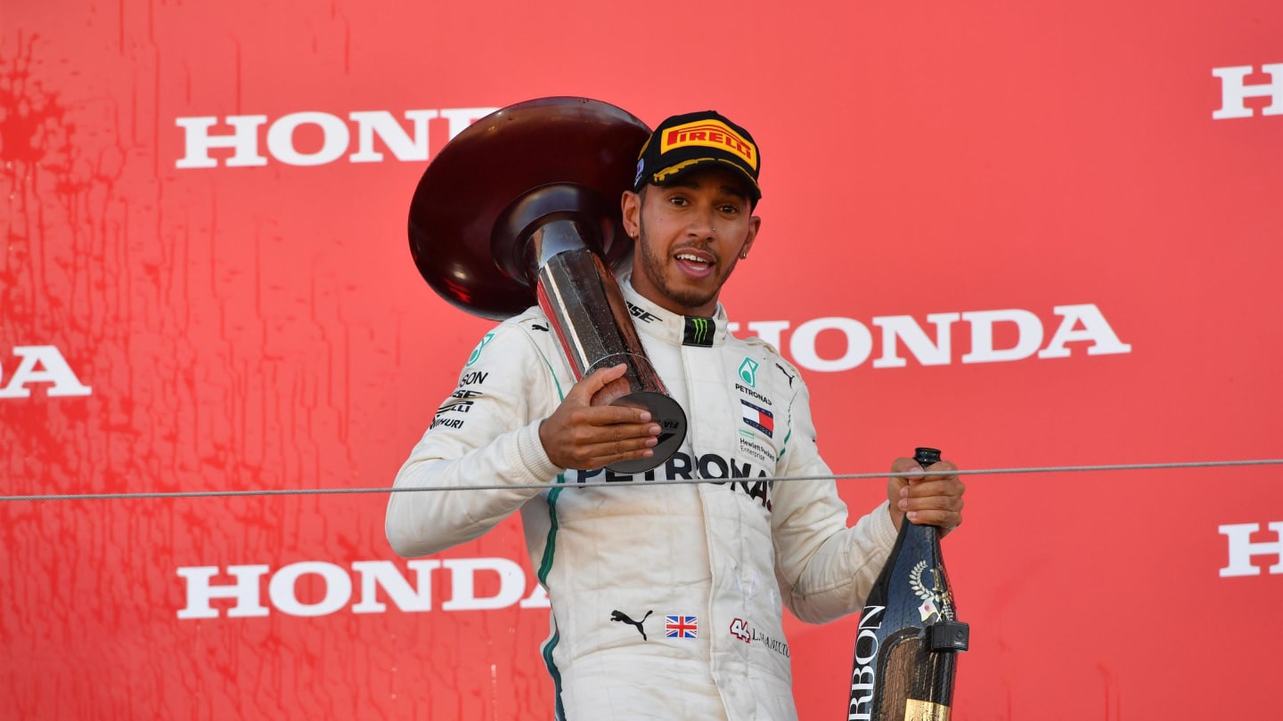 Lewis Hamilton, Mercedes AMG F1 with the trophy and the champagne on the podium at Formula One