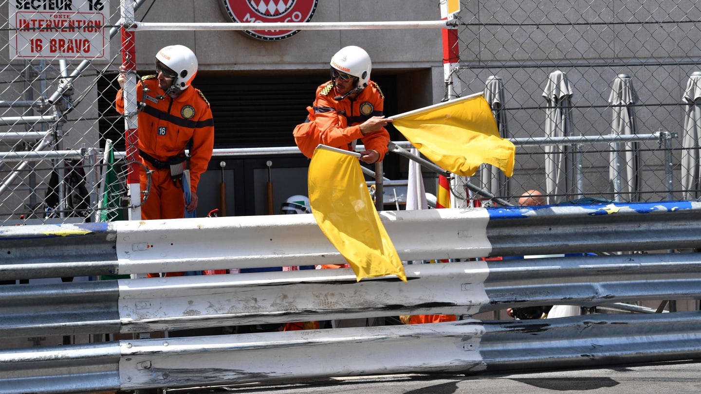 Marshals wave the yellow flags after the crash of Max Verstappen (NED) Red Bull Racing RB14 at Formula One World Championship, Rd6, Monaco Grand Prix, Qualifying, Monte-Carlo, Monaco, Saturday 26 May 2018. © Mark Sutton/Sutton Images