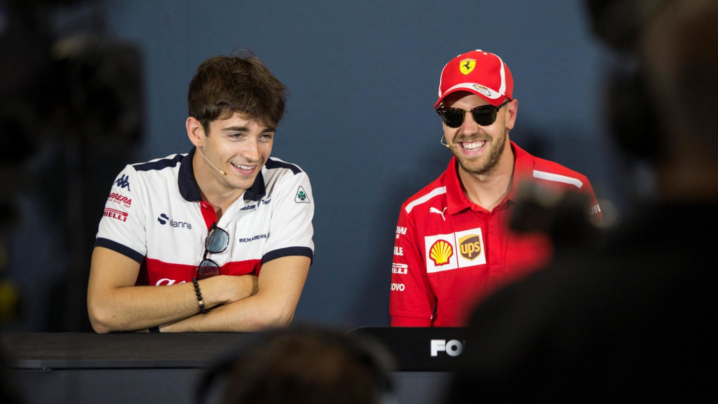 Charles Leclerc (MON) Alfa Romeo Sauber F1 Team and Sebastian Vettel (GER) Ferrari in the Press