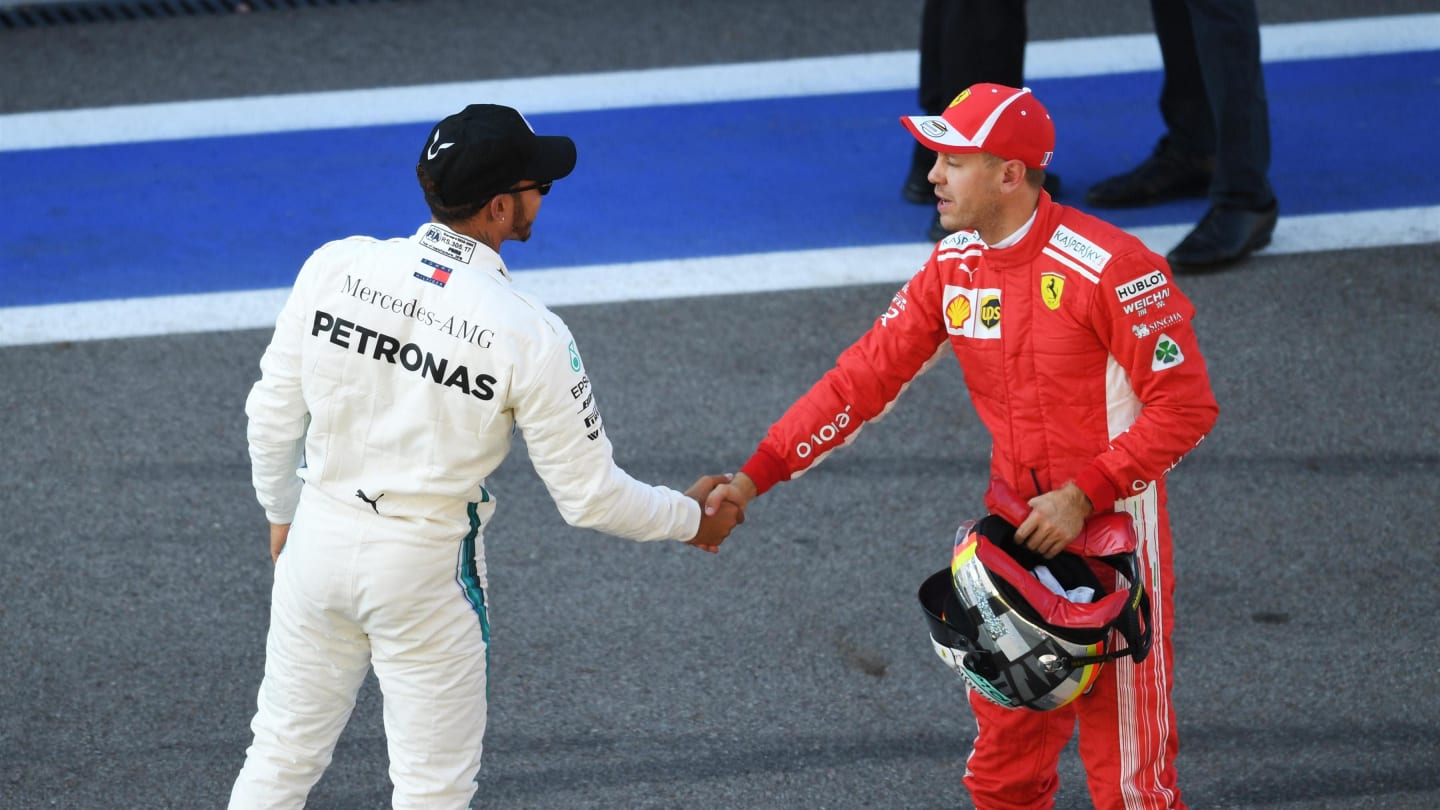 Lewis Hamilton, Mercedes AMG F1 and Sebastian Vettel, Ferrari celebrate in parc ferme at Formula