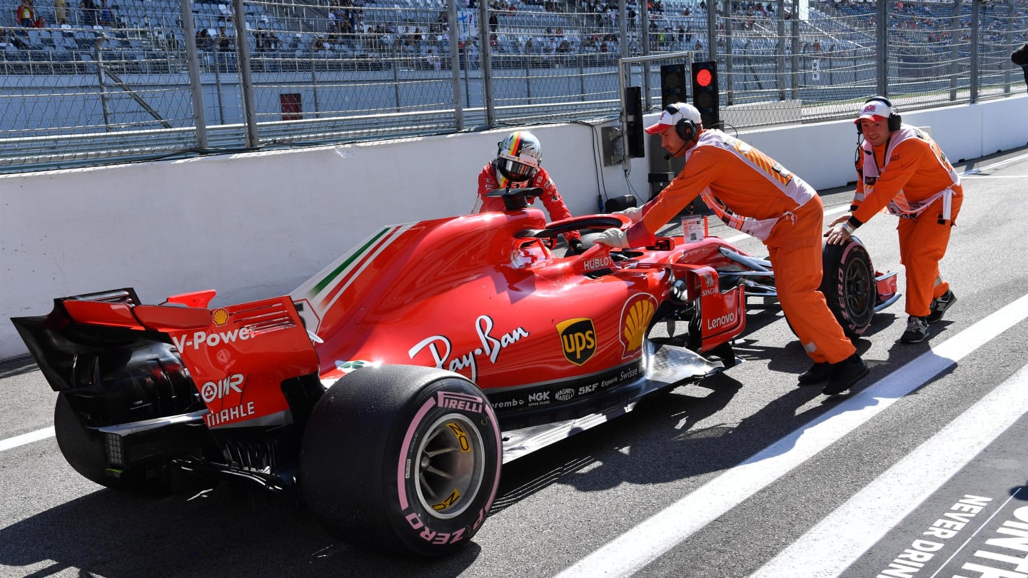 Sebastian Vettel, Ferrari pushes his car back in the pit lane at the end of FP3 at Formula One