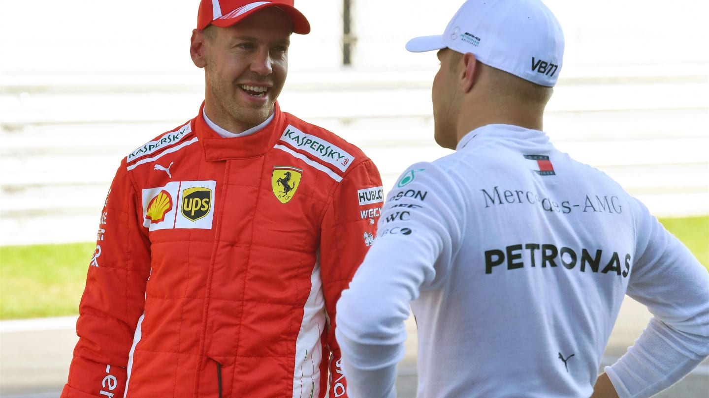 Sebastian Vettel, Ferrari and Valtteri Bottas, Mercedes AMG F1 in parc ferme at Formula One World