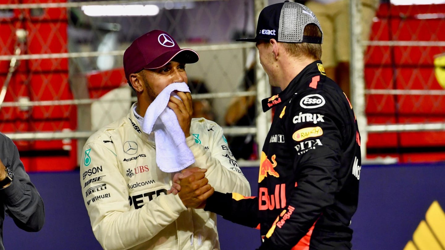 Lewis Hamilton, Mercedes AMG F1 and Max Verstappen, Red Bull Racing celebrate in parc ferme at Formula One World Championship, Rd15, Singapore Grand Prix, Qualifying, Marina Bay Circuit, Singapore, Saturday 15 September 2018.