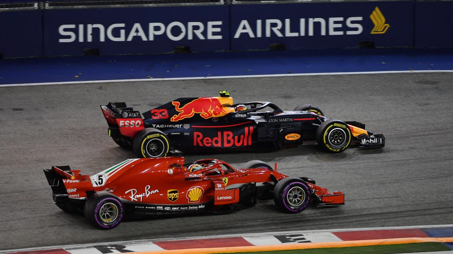 Sebastian Vettel, Ferrari SF71H and Max Verstappen, Red Bull Racing RB14 battle at Formula One World Championship, Rd15, Singapore Grand Prix, Race, Marina Bay Circuit, Singapore, Sunday 16 September 2018.