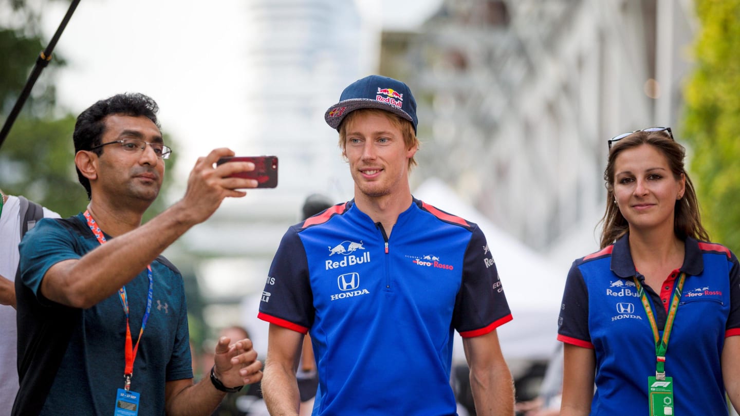 Brendon Hartley, Scuderia Toro Rosso taks a photograph with a fan at Formula One World