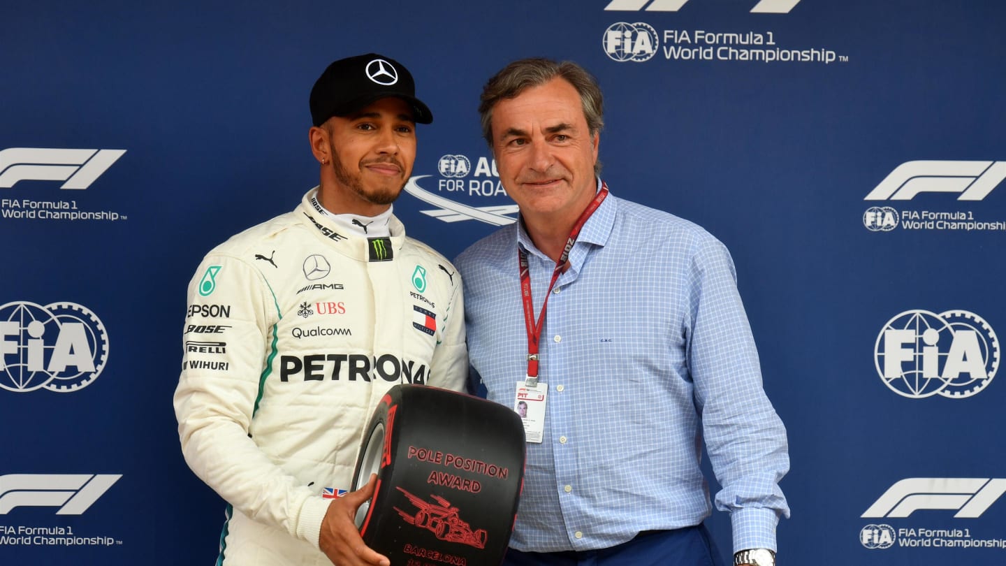 Pole sitter Lewis Hamilton (GBR) Mercedes-AMG F1 receives the Pirelli Pole Position Award from Carlos Sainz (ESP) at Formula One World Championship, Rd5, Spanish Grand Prix, Qualifying, Barcelona, Spain, Saturday 12 May 2018. © Mark Sutton/Sutton Images