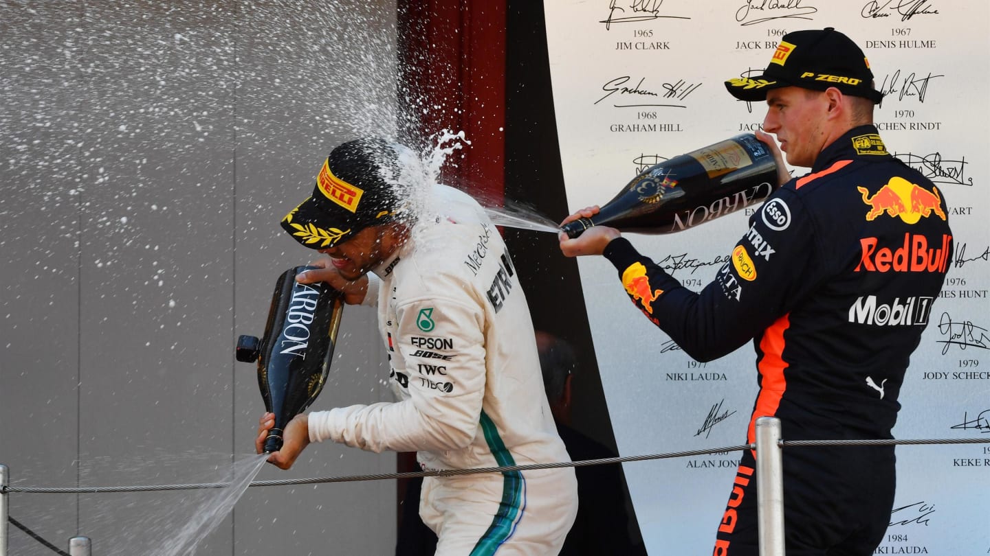 Race winner Lewis Hamilton (GBR) Mercedes-AMG F1 and Max Verstappen (NED) Red Bull Racing celebrate on the podium with the champagne at Formula One World Championship, Rd5, Spanish Grand Prix, Race, Barcelona, Spain, Sunday 13 May 2018. © Mark Sutton/Sutton Images