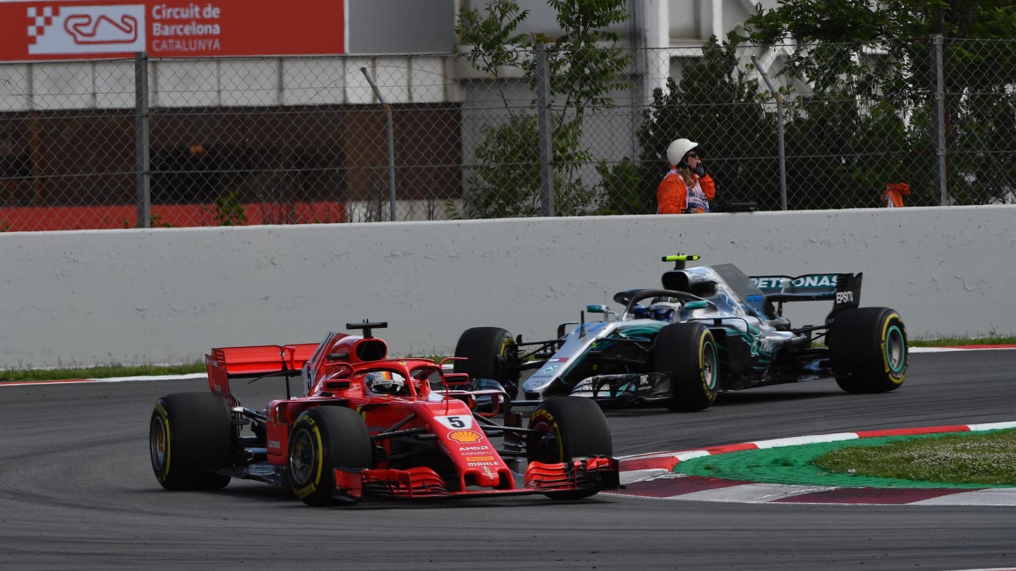 Sebastian Vettel (GER) Ferrari SF-71H leads Valtteri Bottas (FIN) Mercedes-AMG F1 W09 EQ Power+ at