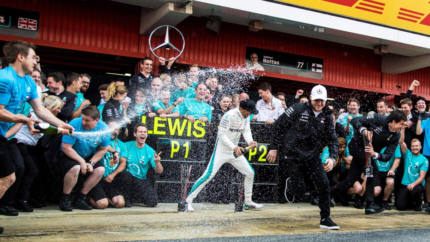 Race winner Lewis Hamilton (GBR) Mercedes-AMG F1 and Valtteri Bottas (FIN) Mercedes-AMG F1 celebrate with the team and the champagne at Formula One World Championship, Rd5, Spanish Grand Prix, Race, Barcelona, Spain, Sunday 13 May 2018. © Manuel Goria/Sut