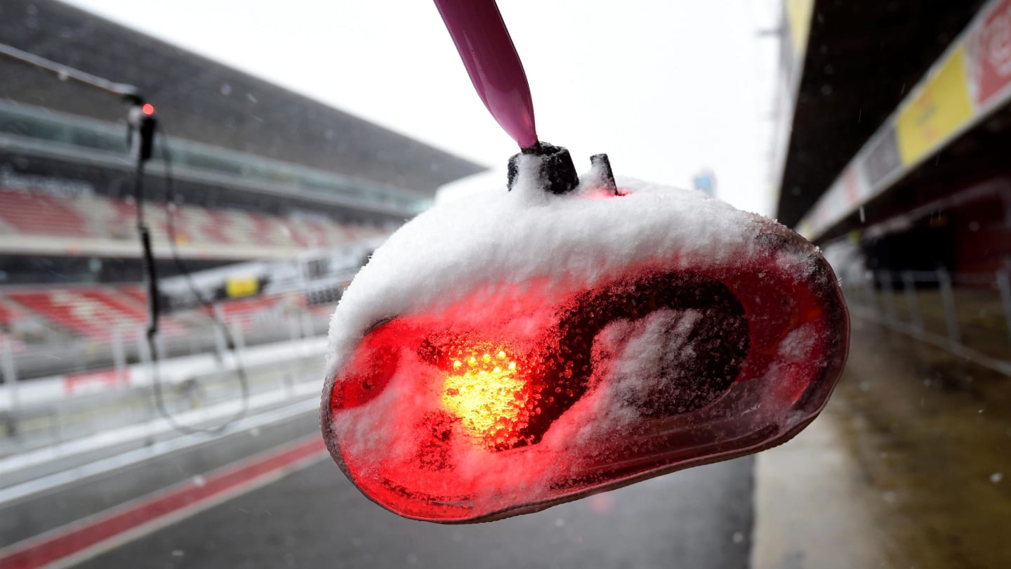 Ferrari pit stop lights as snow stops testing on day three at Formula One Testing, Day Three, Barcelona, Spain, 28 February 2018. © Jerry Andre/Sutton Images