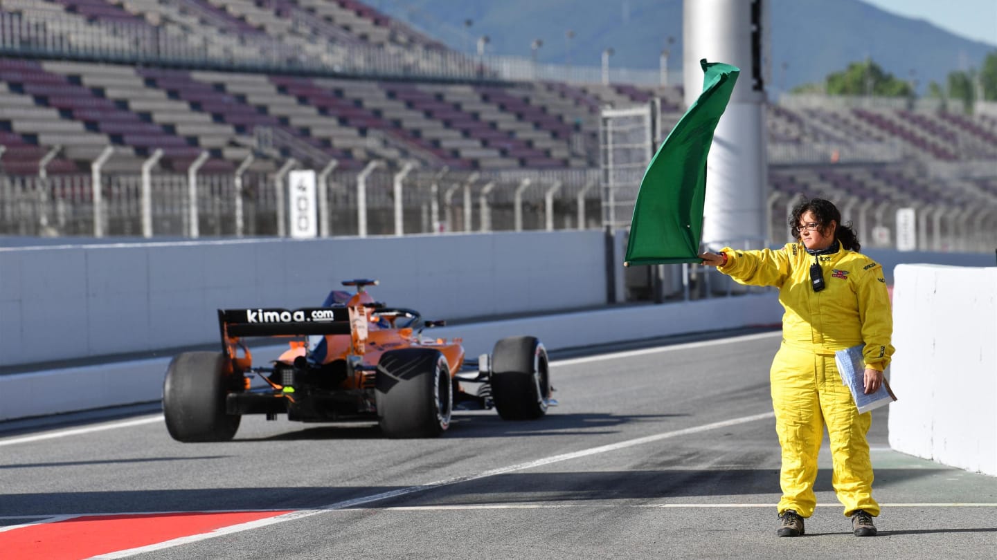 Marshals waces the green flag at Formula One Testing, Day One, Barcelona, Spain, Tuesday 15 May 2018. © Mark Sutton/Sutton Images