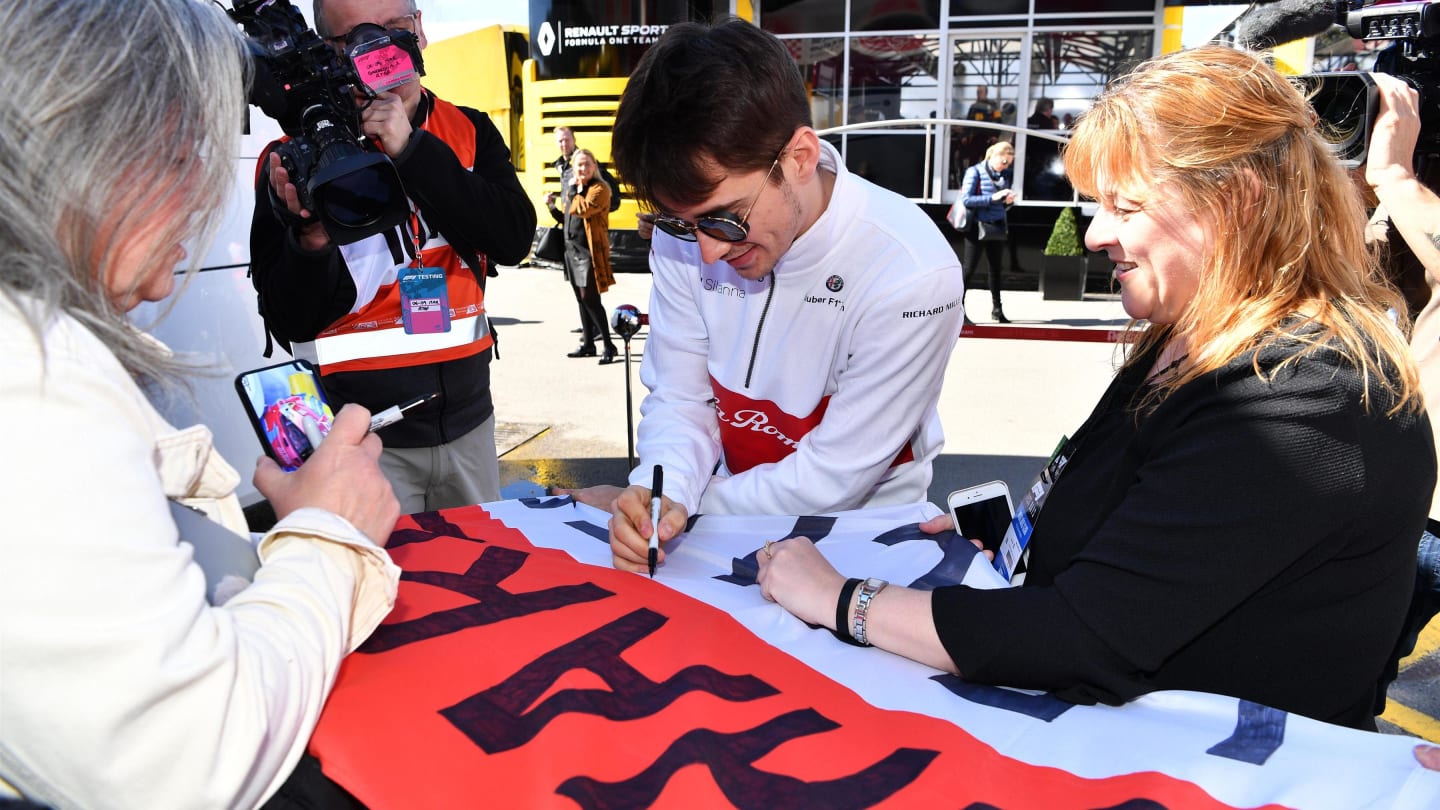 Charles Leclerc (MON) Alfa Romeo Sauber F1 Team signs a flag for fans at Formula One Testing, Day One, Barcelona, Spain, 6 March 2018. © Mark Sutton/Sutton Images