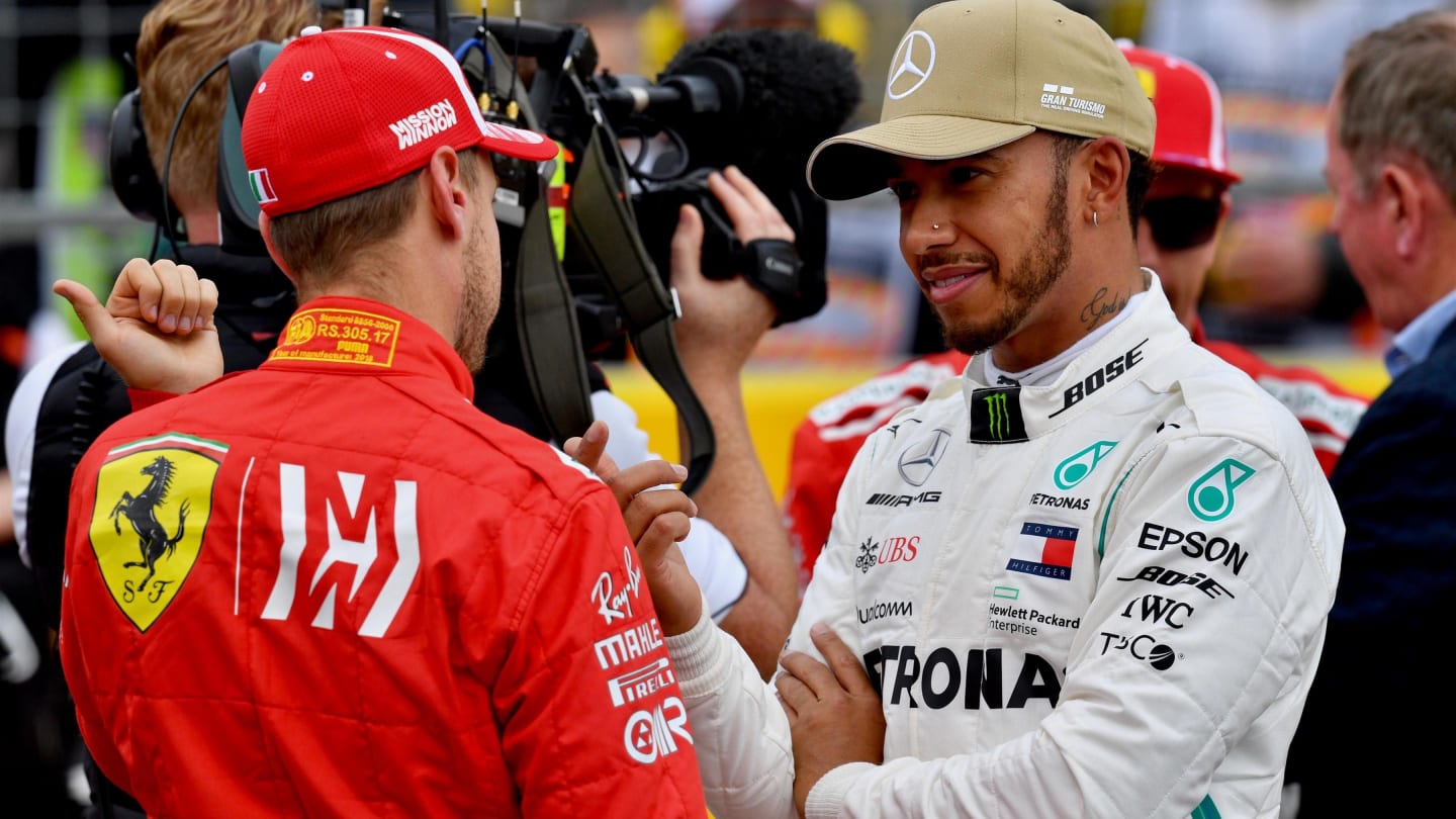 Sebastian Vettel, Ferrari and Lewis Hamilton, Mercedes AMG F1 in parc ferme at Formula World