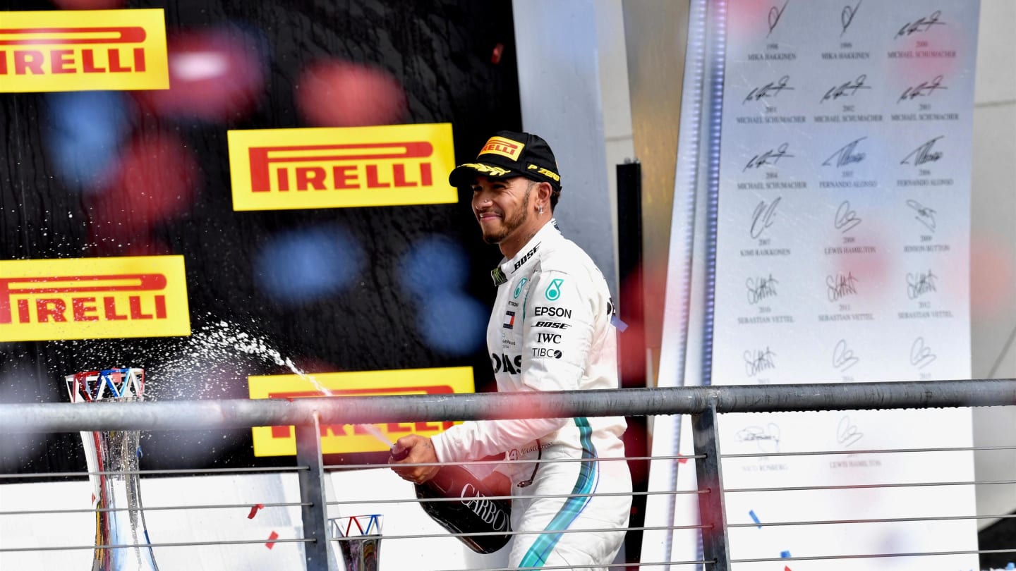 Lewis Hamilton, Mercedes AMG F1 celebrates with the champagne on the podium at Formula One World