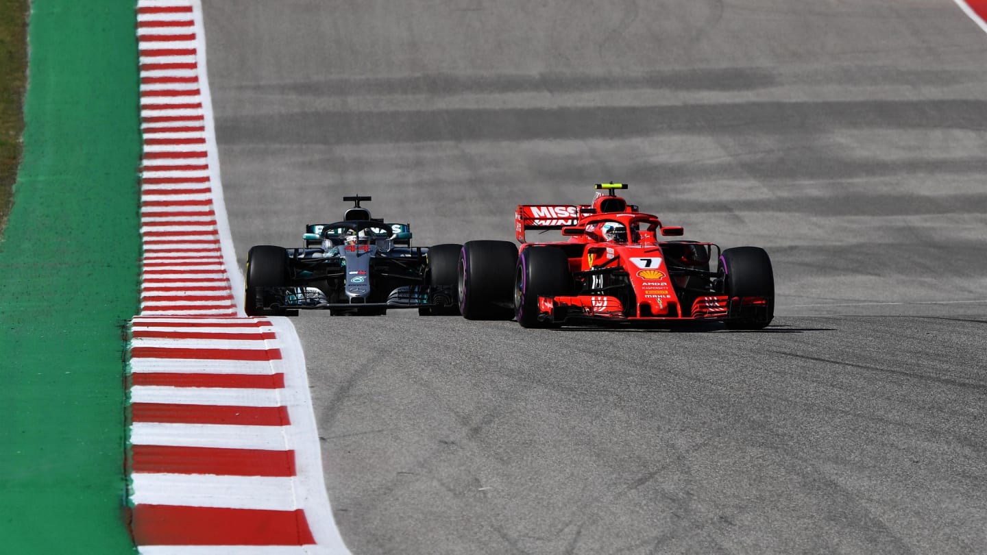 Kimi Raikkonen, Ferrari SF71H leads Lewis Hamilton, Mercedes AMG F1 W09 EQ Power+ at Formula One