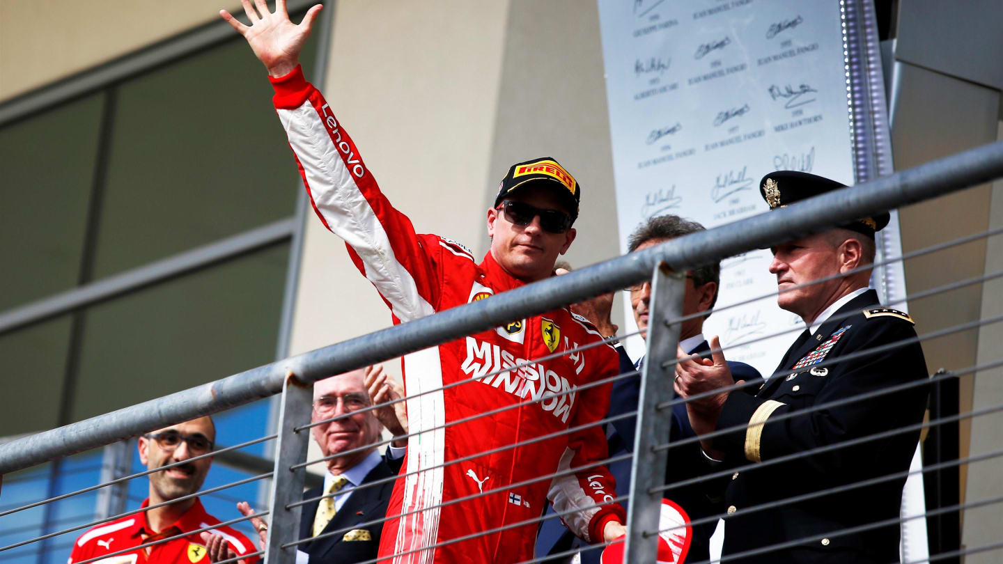 Race winner Kimi Raikkonen, Ferrari celebrates on the podium at Formula One World Championship,