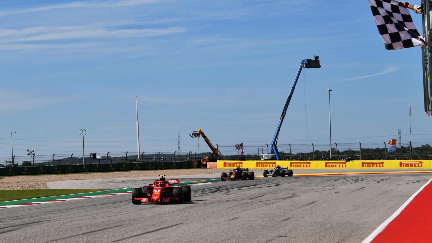 Race winner Kimi Raikkonen, Ferrari SF71H takes the chequered flag at Formula One World