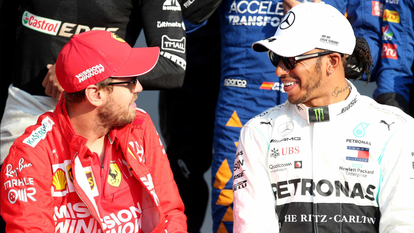 ABU DHABI, UNITED ARAB EMIRATES - DECEMBER 01: Sebastian Vettel of Germany and Ferrari and Lewis