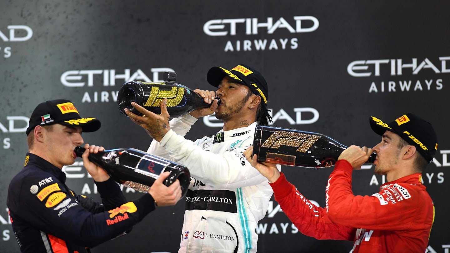 ABU DHABI, UNITED ARAB EMIRATES - DECEMBER 01: Top three finishers Lewis Hamilton of Great Britain