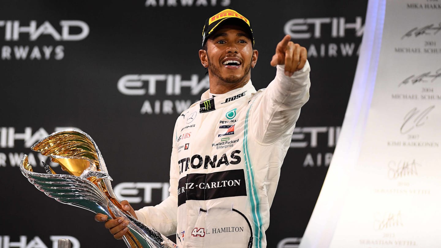 ABU DHABI, UNITED ARAB EMIRATES - DECEMBER 01: Race winner Lewis Hamilton of Great Britain and