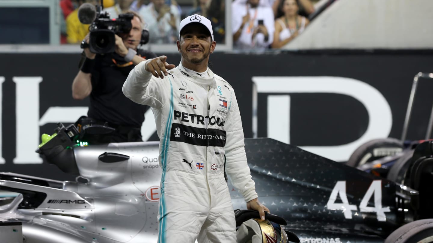 ABU DHABI, UNITED ARAB EMIRATES - DECEMBER 01: Race winner Lewis Hamilton of Great Britain and