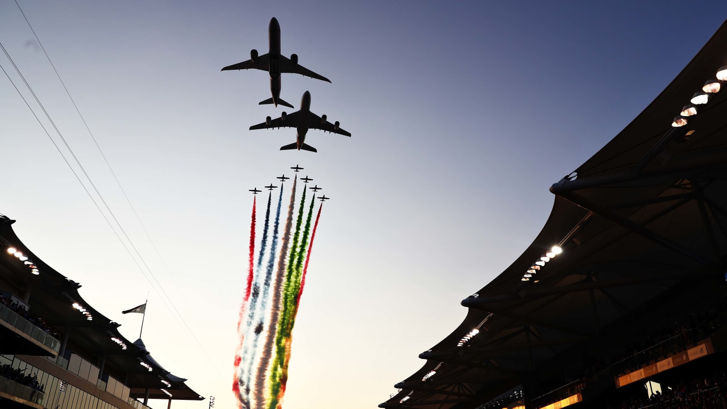ABU DHABI, UNITED ARAB EMIRATES - DECEMBER 01: An aeronautical display is seen over the grid before the F1 Grand Prix of Abu Dhabi at Yas Marina Circuit on December 01, 2019 in Abu Dhabi, United Arab Emirates. (Photo by Mark Thompson/Getty Images)