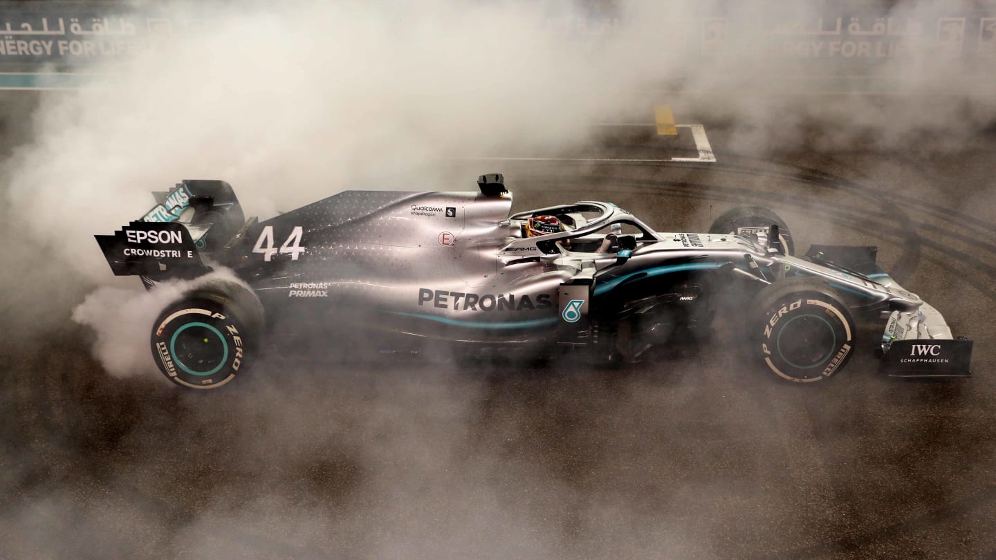 ABU DHABI, UNITED ARAB EMIRATES - DECEMBER 01: Race winner Lewis Hamilton of Great Britain and Mercedes GP celebrates with donuts on track during the F1 Grand Prix of Abu Dhabi at Yas Marina Circuit on December 01, 2019 in Abu Dhabi, United Arab Emirates. (Photo by Mark Thompson/Getty Images)