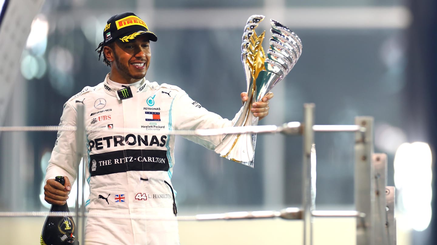 ABU DHABI, UNITED ARAB EMIRATES - DECEMBER 01: Race winner Lewis Hamilton of Great Britain and