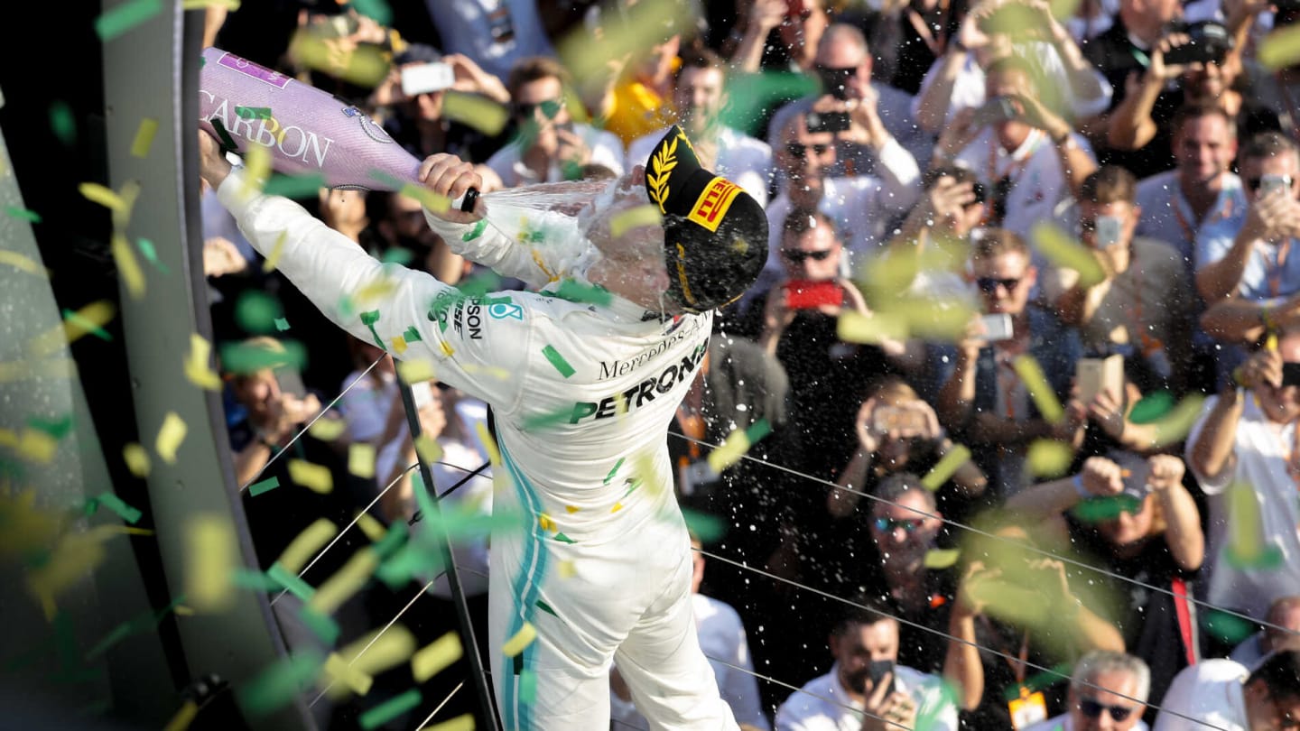 MELBOURNE GRAND PRIX CIRCUIT, AUSTRALIA - MARCH 17: Valtteri Bottas, Mercedes AMG F1, 1st position, celebrates with Champagne on the podium during the Australian GP at Melbourne Grand Prix Circuit on March 17, 2019 in Melbourne Grand Prix Circuit, Australia. (Photo by Steven Tee / LAT Images)