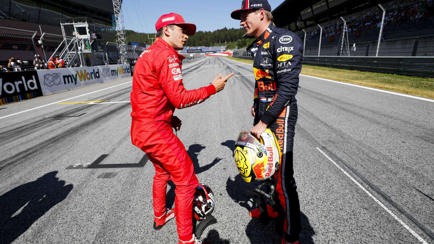 RED BULL RING, AUSTRIA - JUNE 29: Pole man Charles Leclerc, Ferrari, talks with Max Verstappen, Red Bull Racing, after Qualifying during the Austrian GP at Red Bull Ring on June 29, 2019 in Red Bull Ring, Austria. (Photo by Steven Tee / LAT Images)