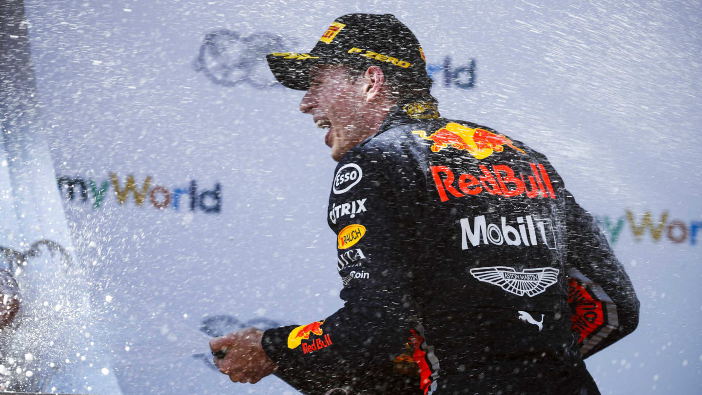 RED BULL RING, AUSTRIA - JUNE 30: Max Verstappen, Red Bull Racing, 1st position, sprays Champagne on the podium during the Austrian GP at Red Bull Ring on June 30, 2019 in Red Bull Ring, Austria. (Photo by Glenn Dunbar / LAT Images)