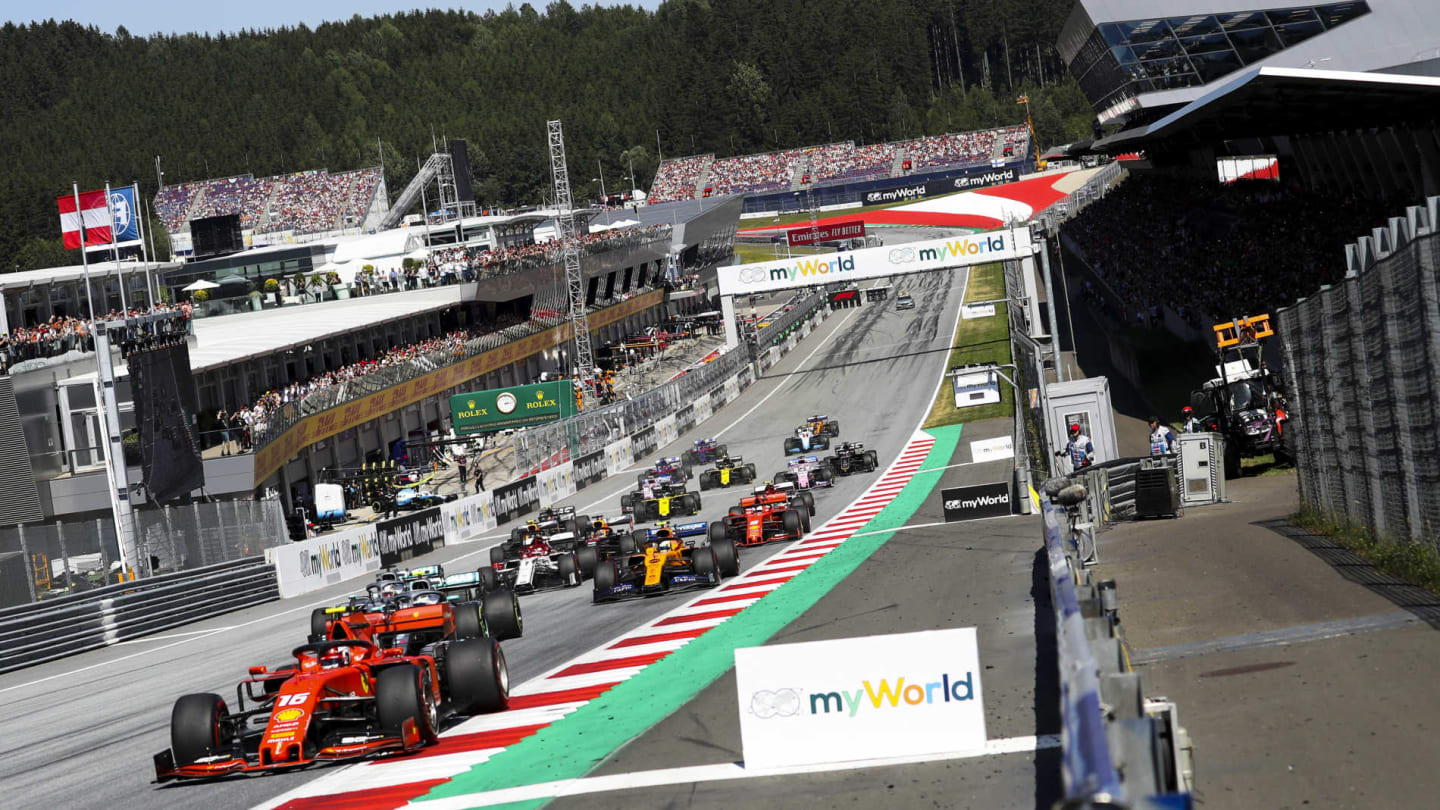 RED BULL RING, AUSTRIA - JUNE 30: Charles Leclerc, Ferrari SF90, leads Valtteri Bottas, Mercedes