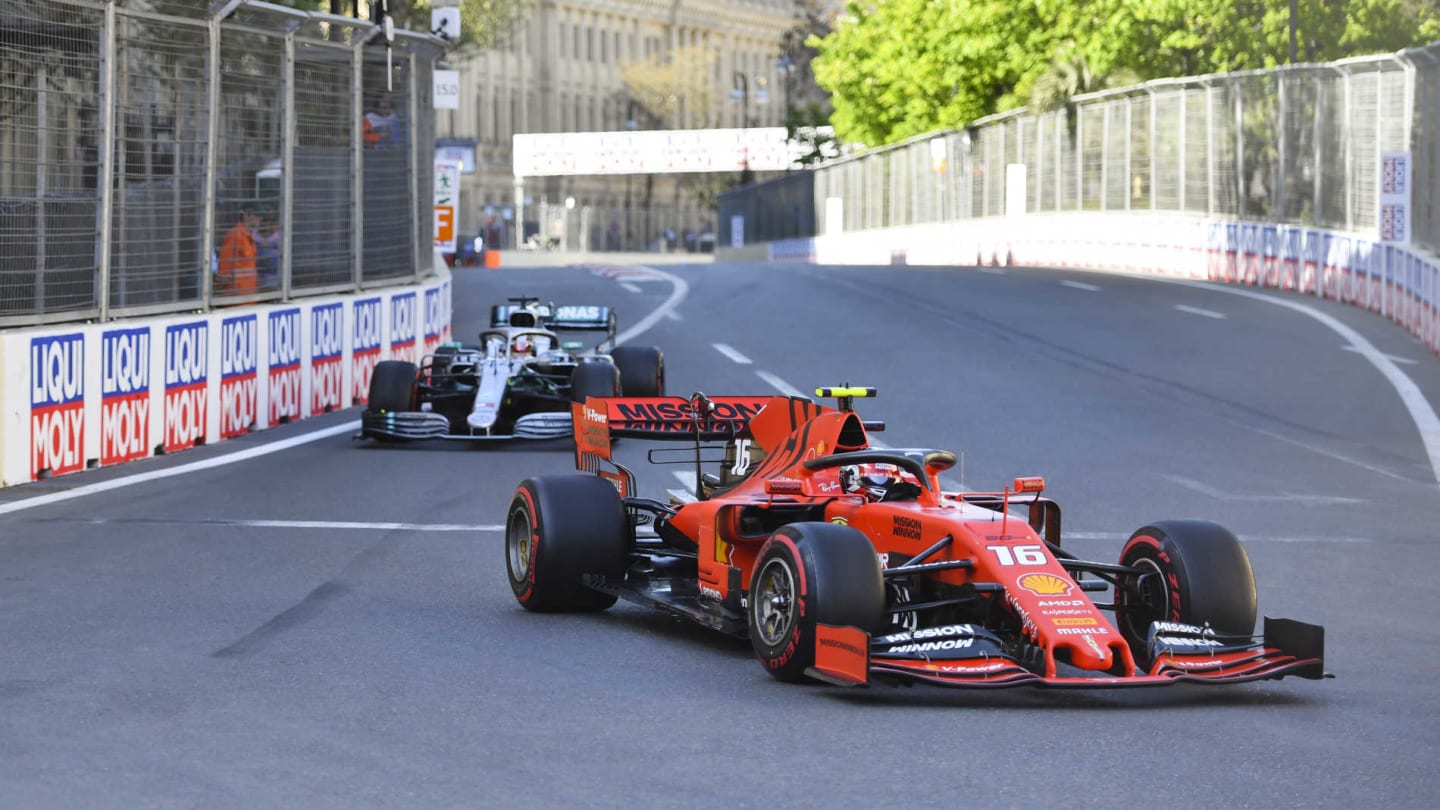 BAKU CITY CIRCUIT, AZERBAIJAN - APRIL 28: Charles Leclerc, Ferrari SF90, leads Lewis Hamilton,