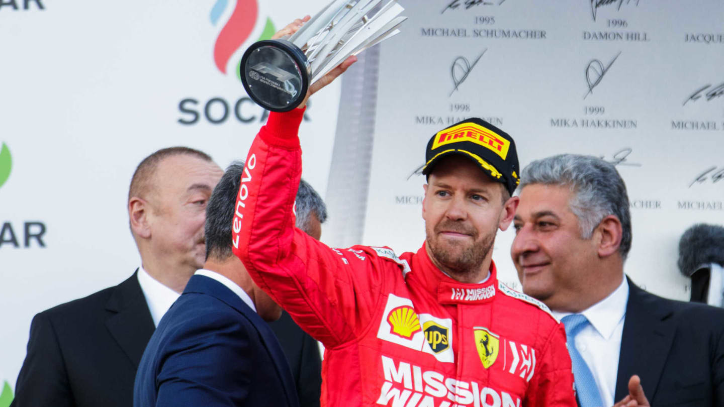 BAKU CITY CIRCUIT, AZERBAIJAN - APRIL 28: Sebastian Vettel, Ferrari, 3rd position, with his trophy