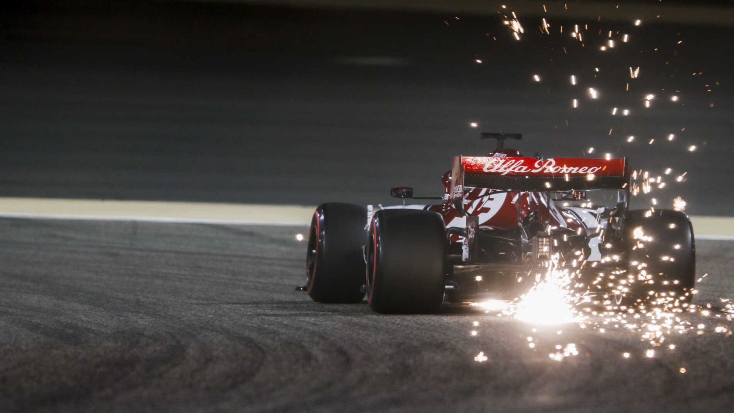 BAHRAIN INTERNATIONAL CIRCUIT, BAHRAIN - MARCH 30: Sparks fly from the rear of Kimi Raikkonen, Alfa